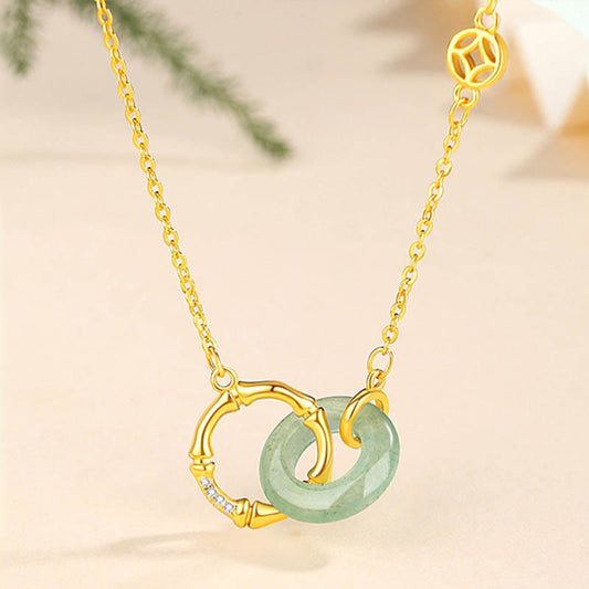 Collar con colgante de plata de ley 925 con aventurina verde natural, moneda de bambú y hebilla de la paz.