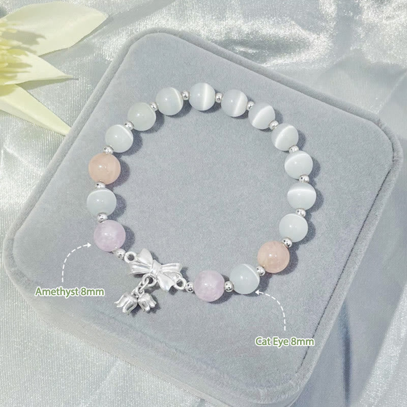 Pulsera con dije de roseta de amatista y lavanda con ojo de gato y piedras de Buda