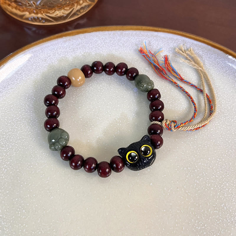 Pulsera de madera con borlas de la paz, con piedras de Buda, madera de ébano y pata de jade de gato encantador