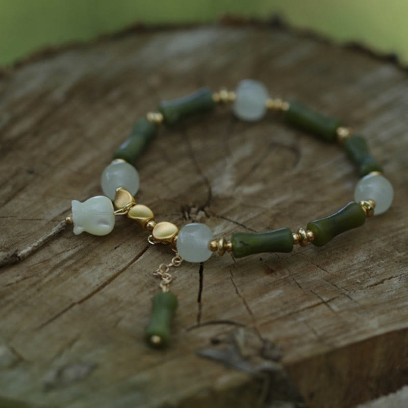 Pulsera de la riqueza con piedras de Buda, bambú verde, jade y lirio de los valles