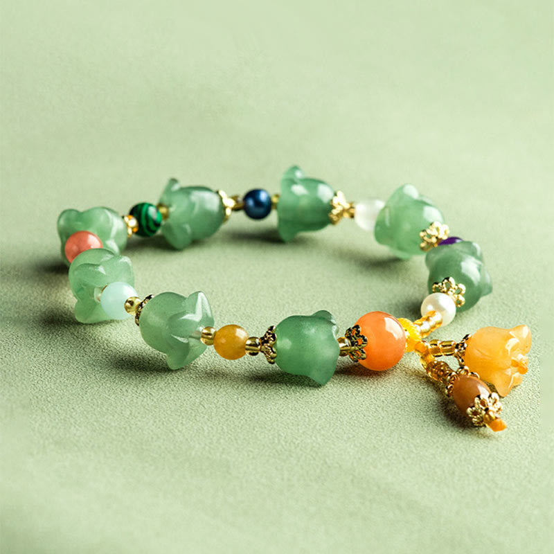 Pulsera de la suerte con flor de magnolia y aventurina verde de Buddha Stones