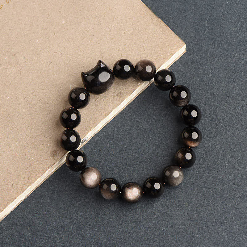 Pulsera de protección con piedras de Buda, obsidiana dorada y obsidiana plateada con brillo, con forma de pata de gato de la suerte.