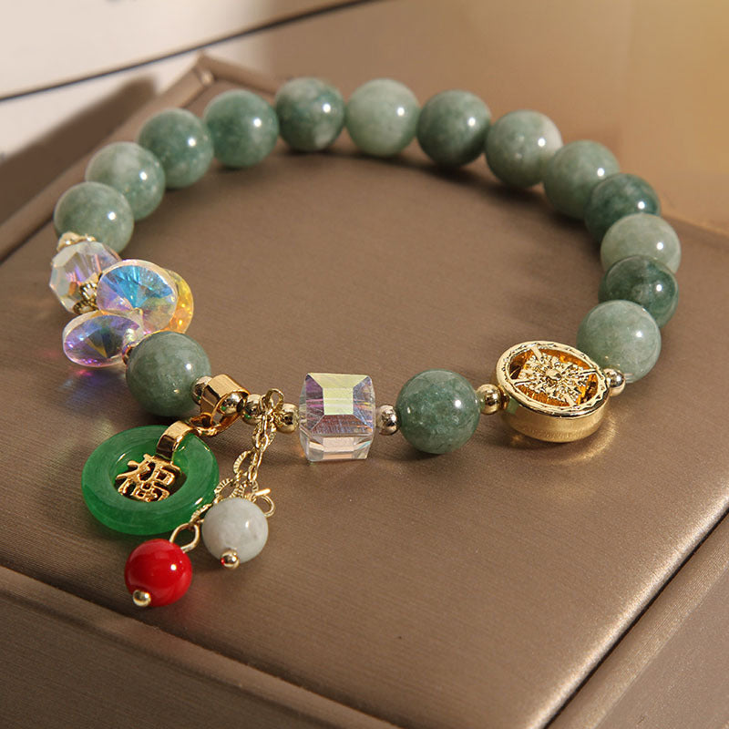 Pulsera curativa con dijes de jade fu y cuarzo fresa de Buda