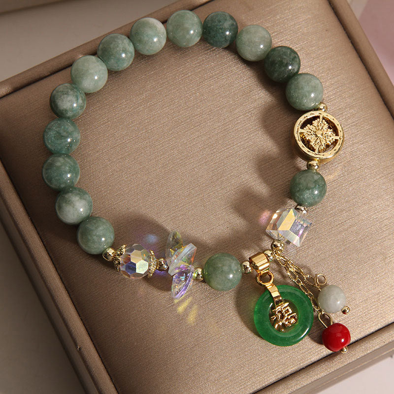 Pulsera curativa con dijes de jade fu y cuarzo fresa de Buda