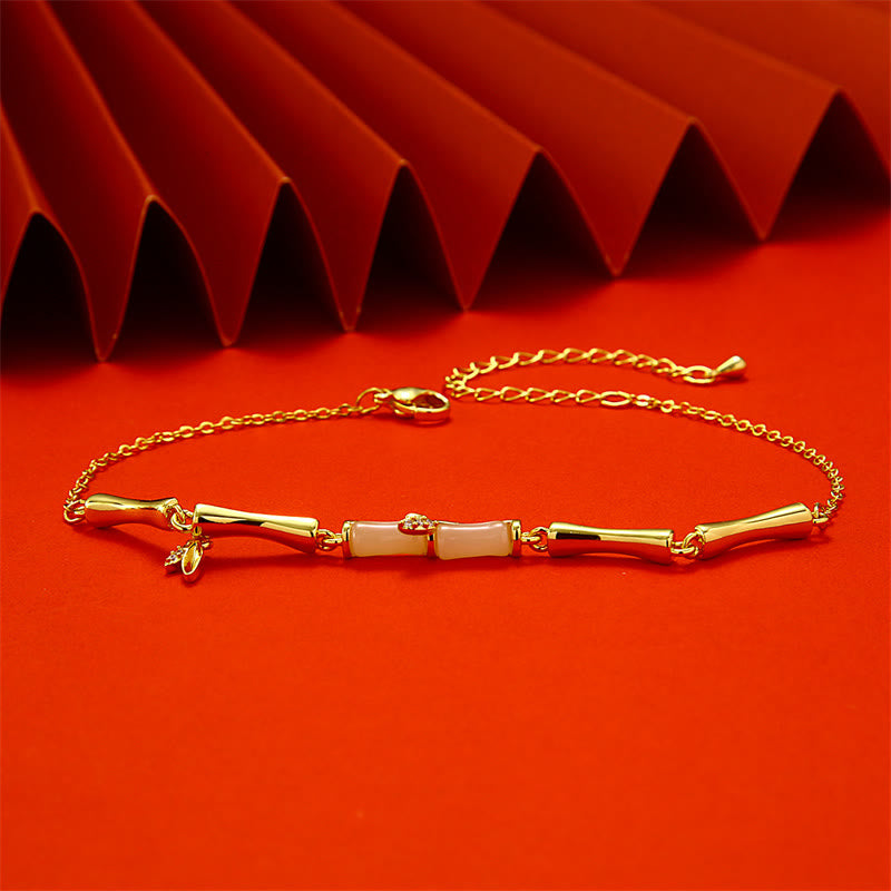 Tobillera de cobre con diseño de bambú dorado y piedras de Buda