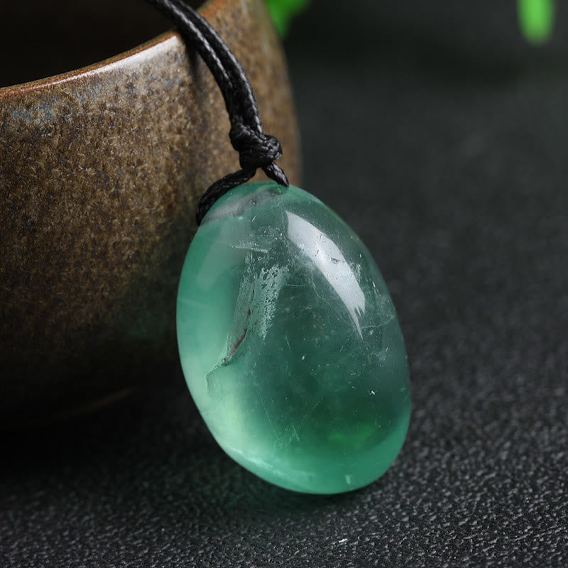 Colgante de fluorita verde con piedras de Buda