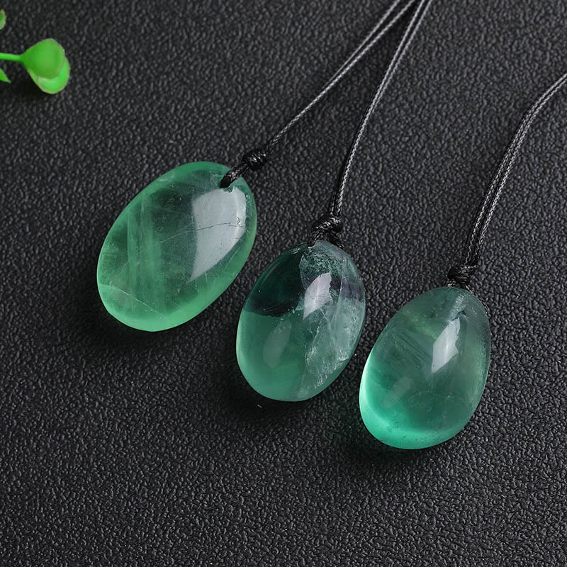 Colgante de fluorita verde con piedras de Buda