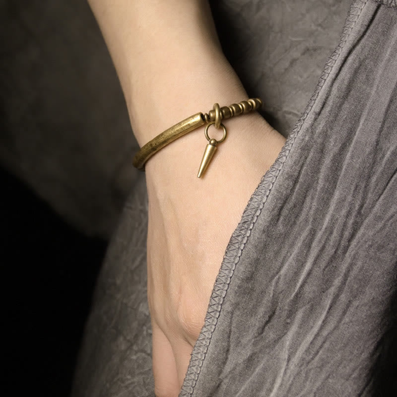 Pulsera sencilla de cobre y latón con piedras de Buda para equilibrar la riqueza