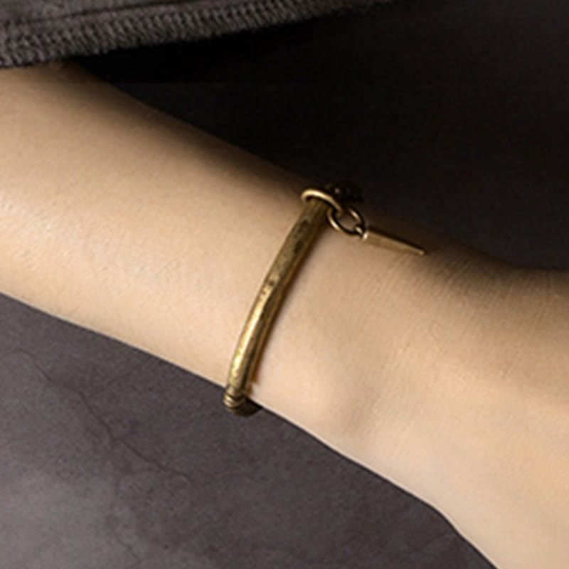 Pulsera sencilla de cobre y latón con piedras de Buda para equilibrar la riqueza