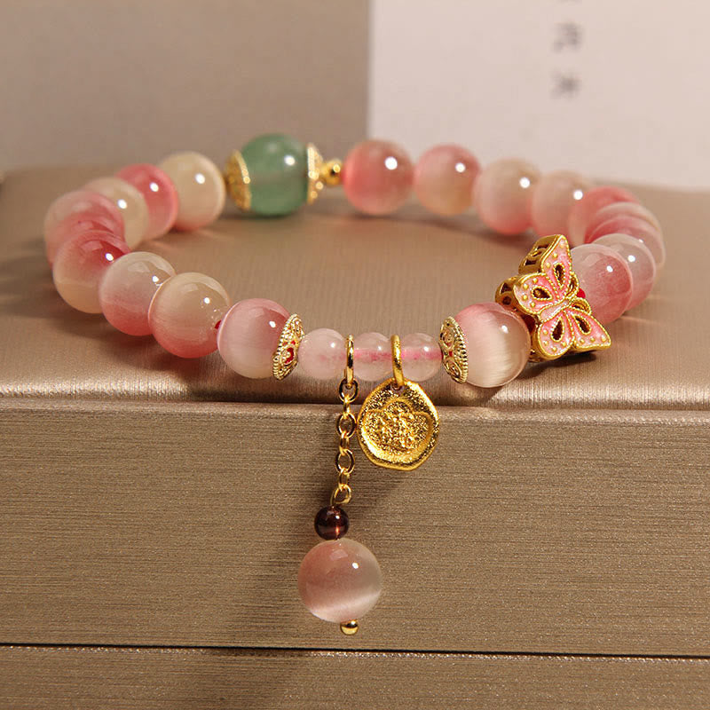 Pulsera de la paz con mariposa y ojo de gato rosa degradado con piedras de Buda