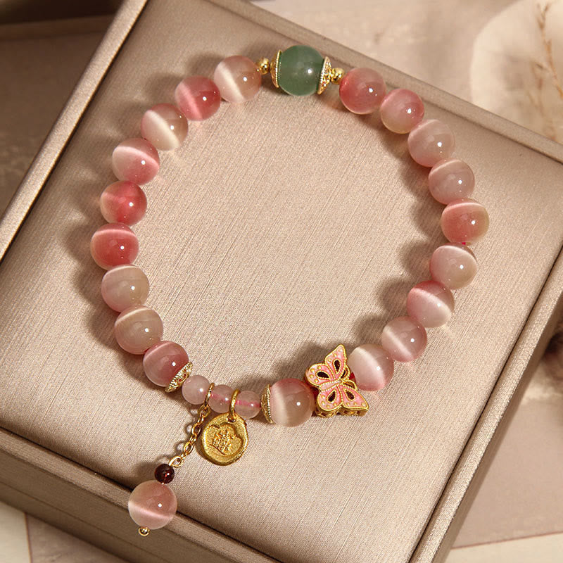 Pulsera de la paz con mariposa y ojo de gato rosa degradado con piedras de Buda