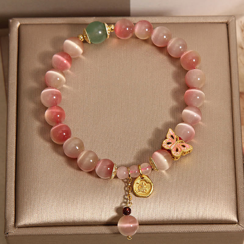 Pulsera de la paz con mariposa y ojo de gato rosa degradado con piedras de Buda