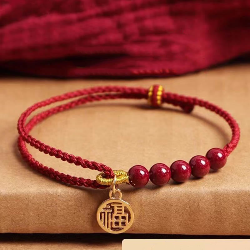 Pulsera trenzada hecha a mano con cuentas de cinabrio y carácter Fu de Buda con hilo rojo bendecido