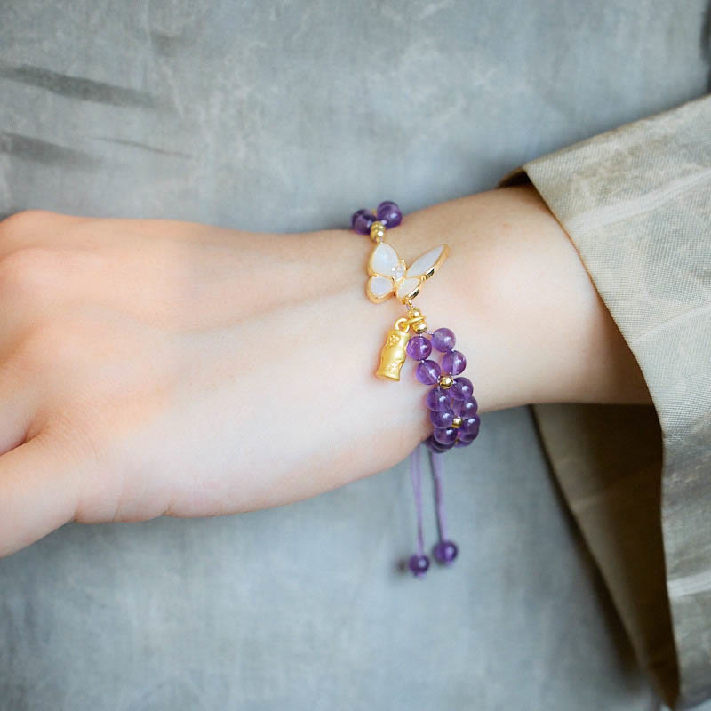 Pulsera de hilo trenzado con piedras de Buda, amatista, mariposa y bambú que alivia el estrés.