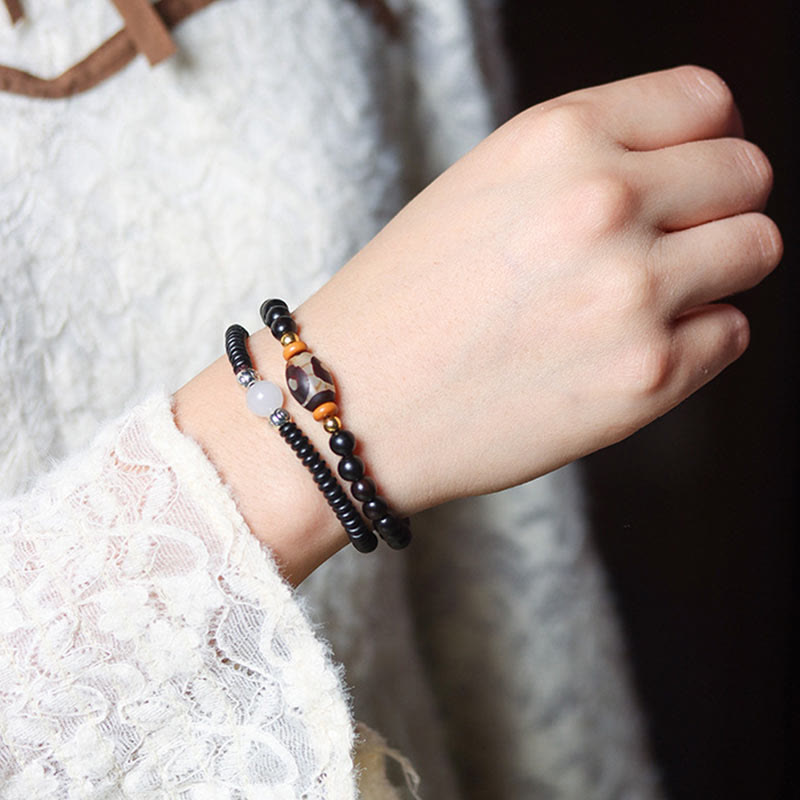 Pulsera de doble vuelta con cuentas Dzi de sándalo verde y ébano con piedras de Buda, equilibrio y calma