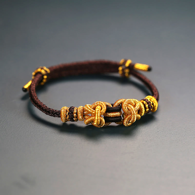 Pulsera de nudo de silla de montar con hilo rojo y piedras de Buda