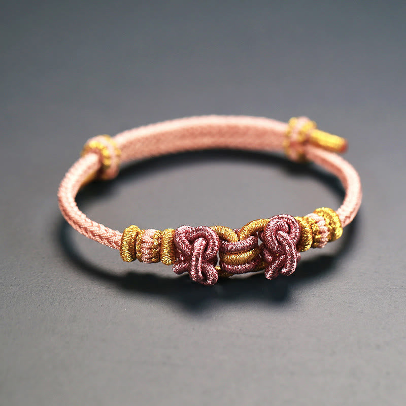 Pulsera de nudo de silla de montar con hilo rojo y piedras de Buda