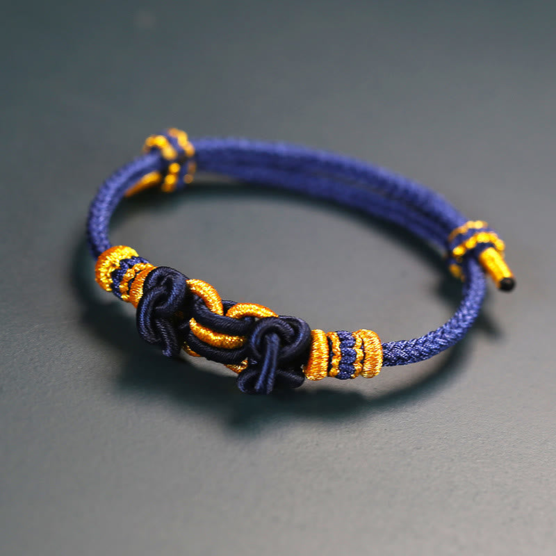 Pulsera de nudo de silla de montar con hilo rojo y piedras de Buda