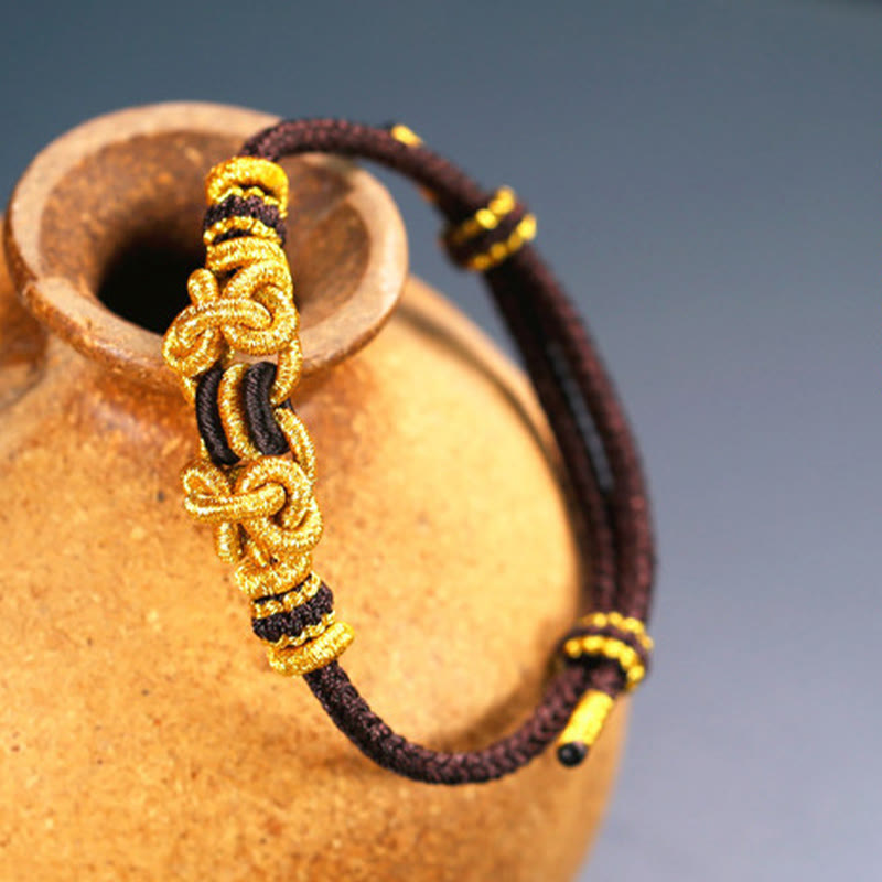 Pulsera de nudo de silla de montar con hilo rojo y piedras de Buda
