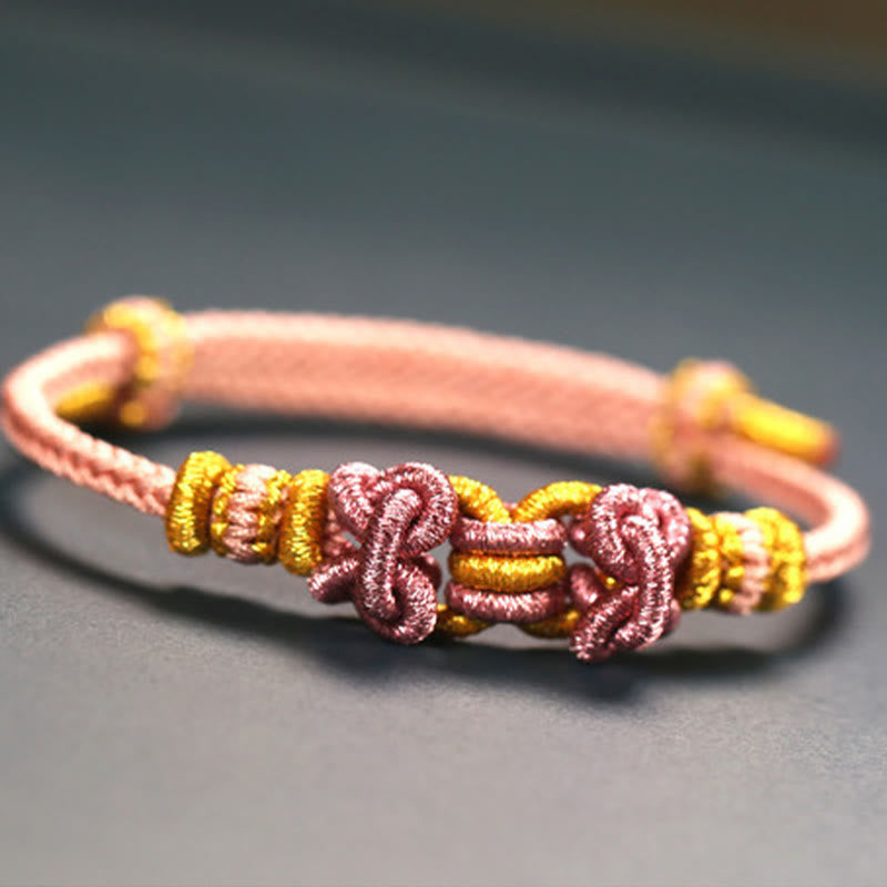 Pulsera de nudo de silla de montar con hilo rojo y piedras de Buda