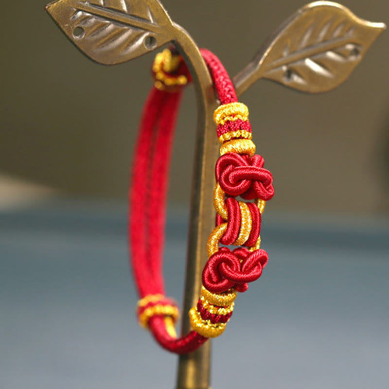 Pulsera de nudo de silla de montar con hilo rojo y piedras de Buda
