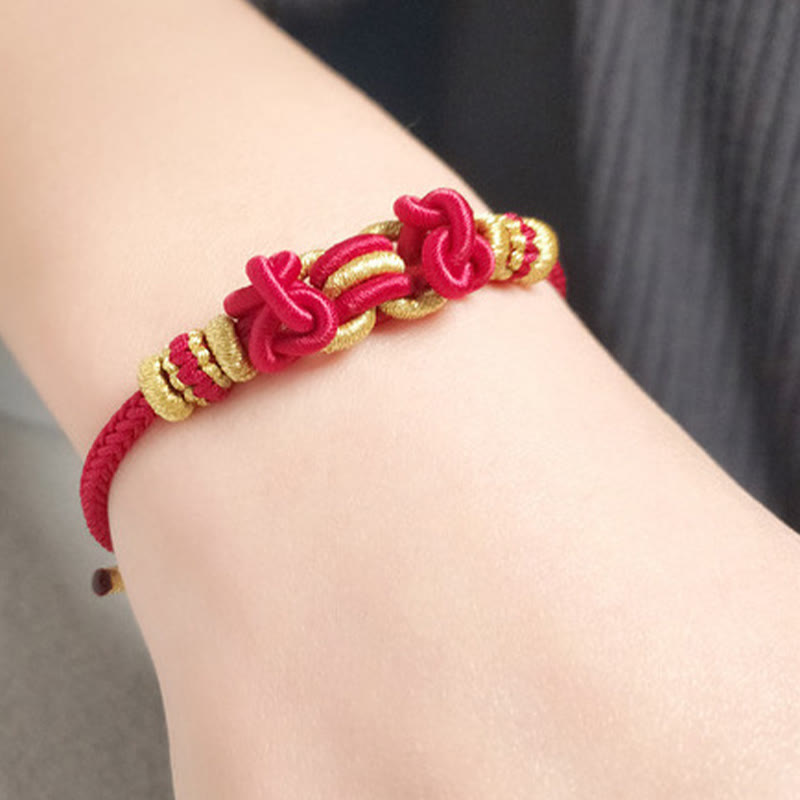 Pulsera de nudo de silla de montar con hilo rojo y piedras de Buda