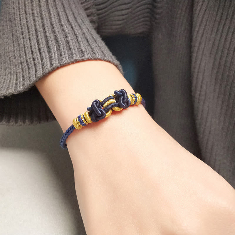Pulsera de nudo de silla de montar con hilo rojo y piedras de Buda