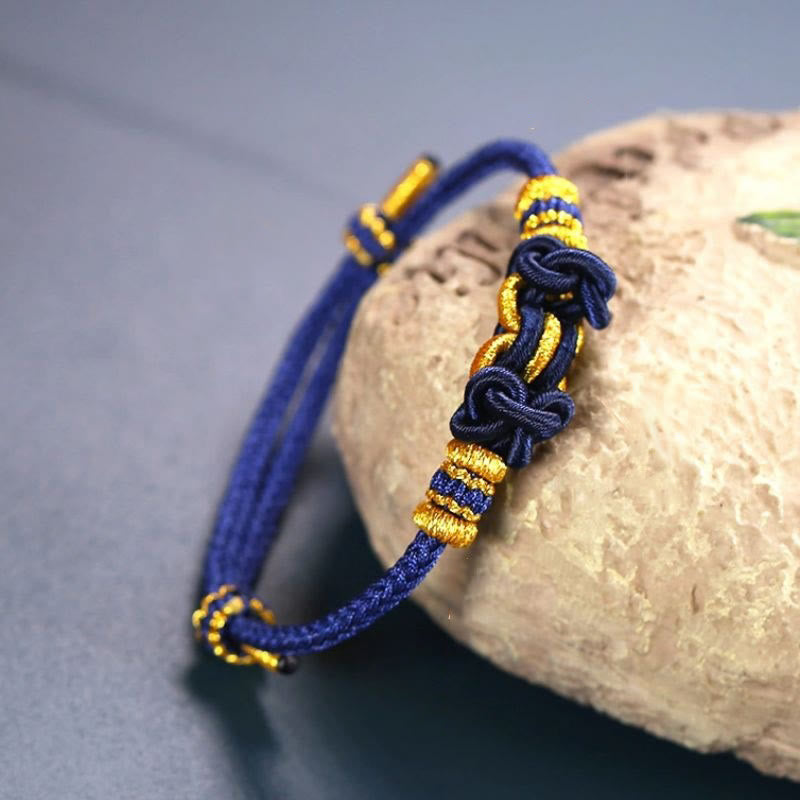 Pulsera de nudo de silla de montar con hilo rojo y piedras de Buda