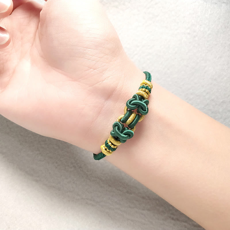 Pulsera de nudo de silla de montar con hilo rojo y piedras de Buda
