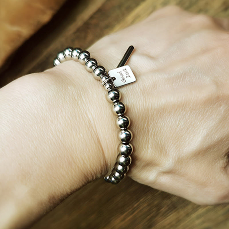 Pulsera de equilibrio de la buena suerte de acero y titanio con piedras de Buda