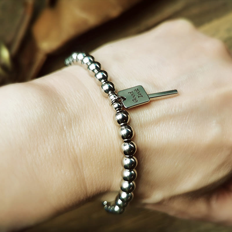 Pulsera de equilibrio de la buena suerte de acero y titanio con piedras de Buda