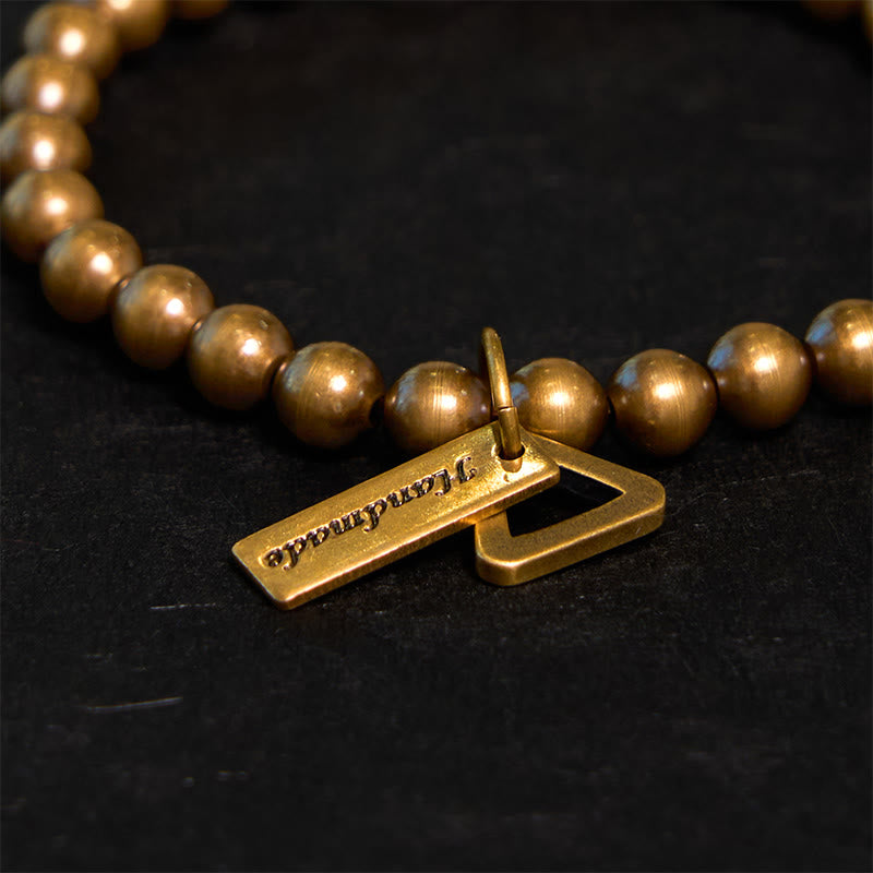 Pulsera de equilibrio con cuentas de cobre y piedras de Buda