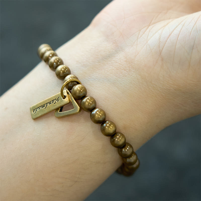 Pulsera de equilibrio con cuentas de cobre y piedras de Buda