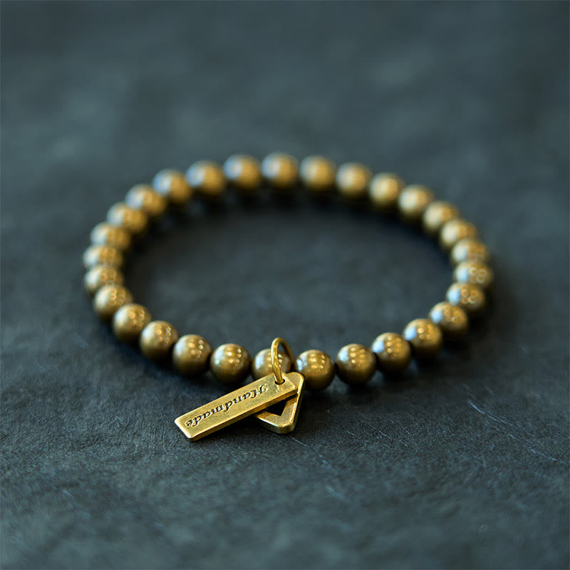 Pulsera de equilibrio con cuentas de cobre y piedras de Buda