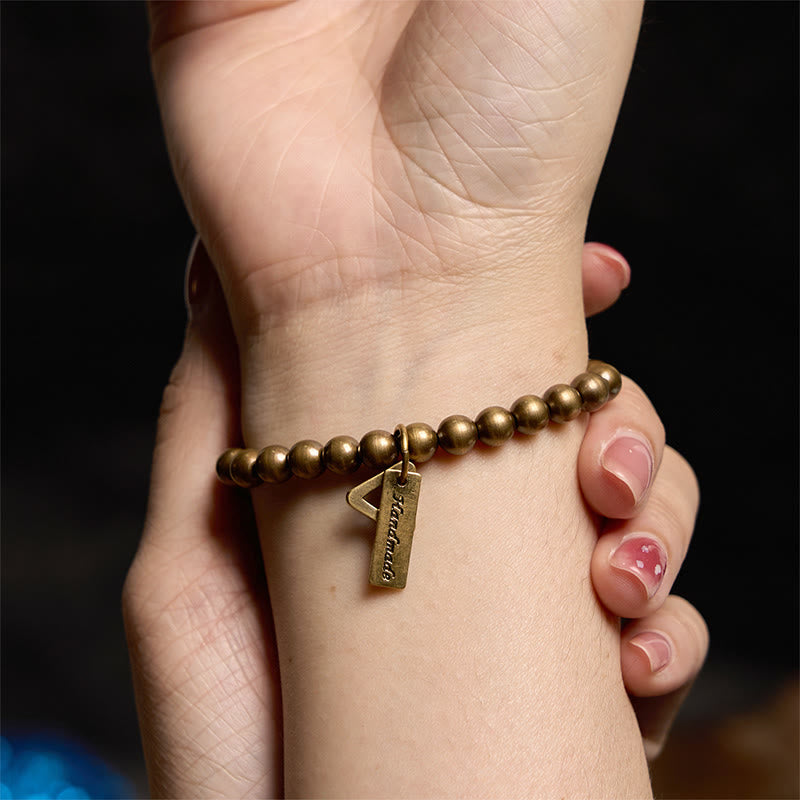 Pulsera de equilibrio con cuentas de cobre y piedras de Buda