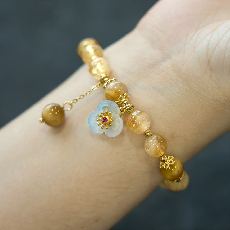 Pulsera de generosidad con citrino, ojo de tigre y flor de Buda