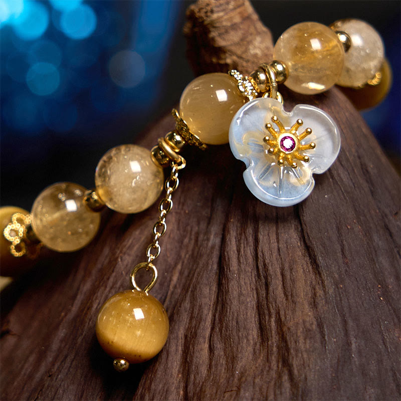Pulsera de generosidad con citrino, ojo de tigre y flor de Buda