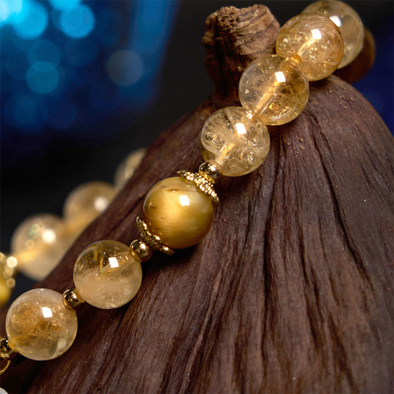 Pulsera de generosidad con citrino, ojo de tigre y flor de Buda