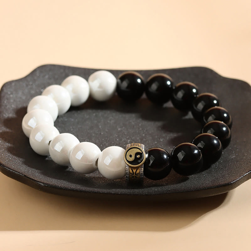 Pulsera Yin Yang con cuentas de porcelana blanca y obsidiana negra y piedras de Buda
