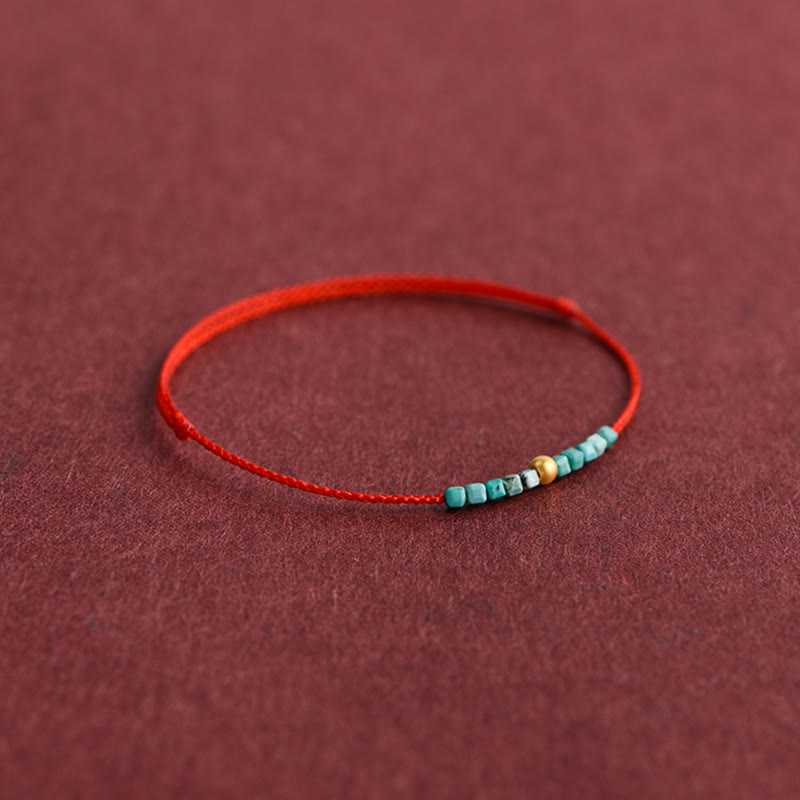 Pulsera trenzada con cuentas de oro 999 y turquesa para protección del tobillo.