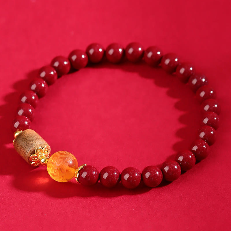 Pulsera de bendición de ámbar, cinabrio y madera de agar con piedras de Buda