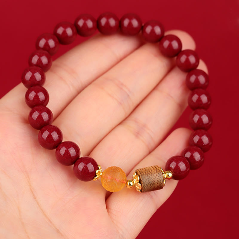 Pulsera de bendición de ámbar, cinabrio y madera de agar con piedras de Buda