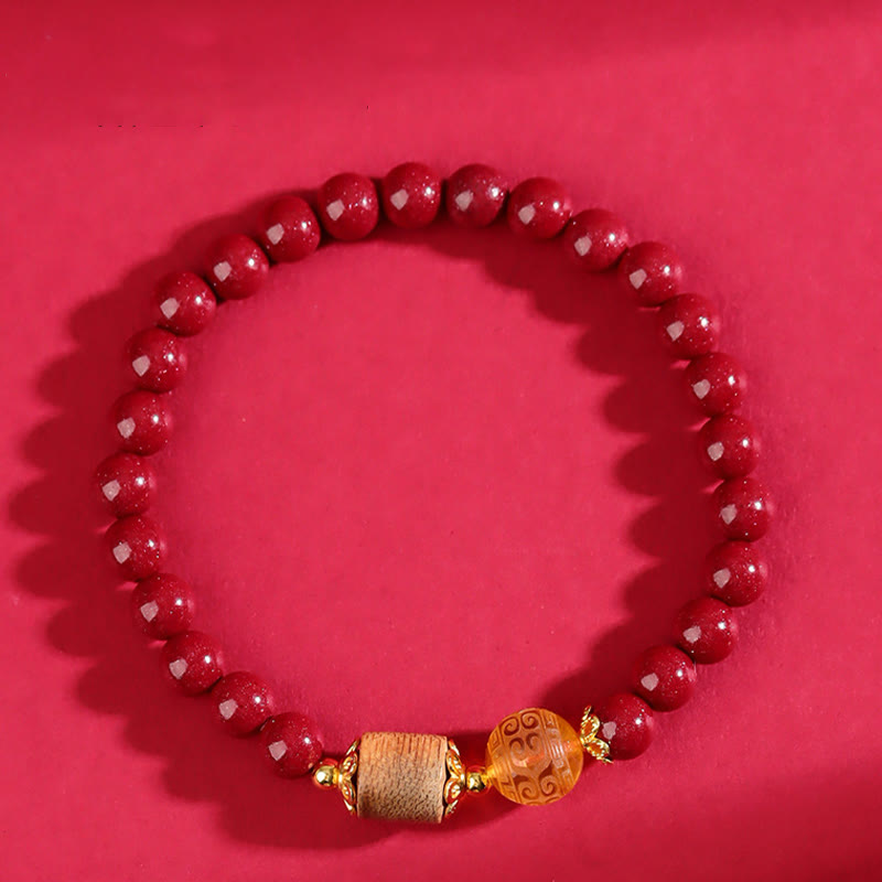 Pulsera de bendición de ámbar, cinabrio y madera de agar con piedras de Buda