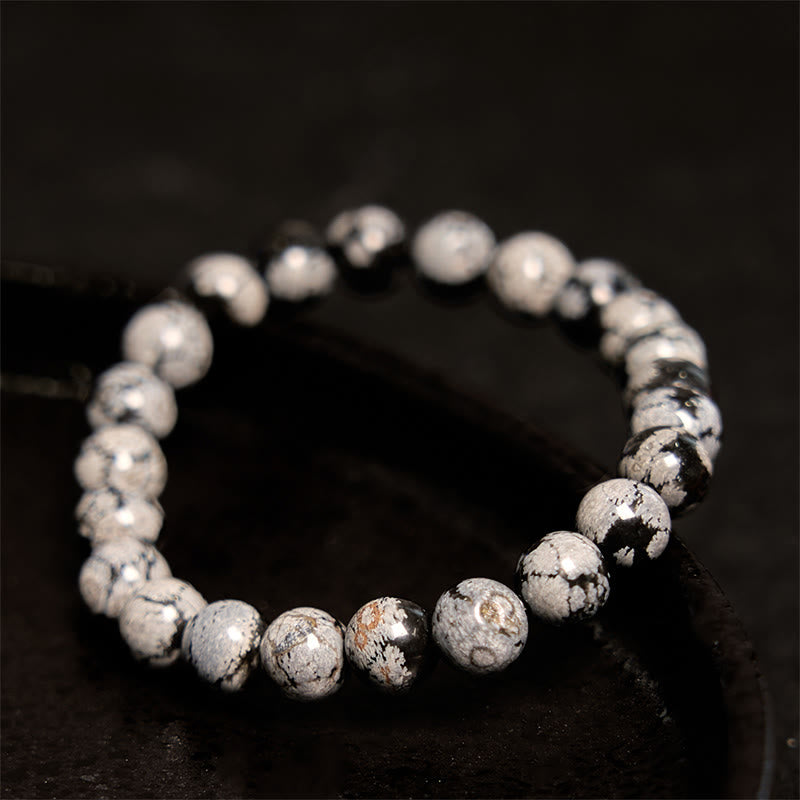 Pulsera de equilibrio de obsidiana y copo de nieve de piedra de Buda
