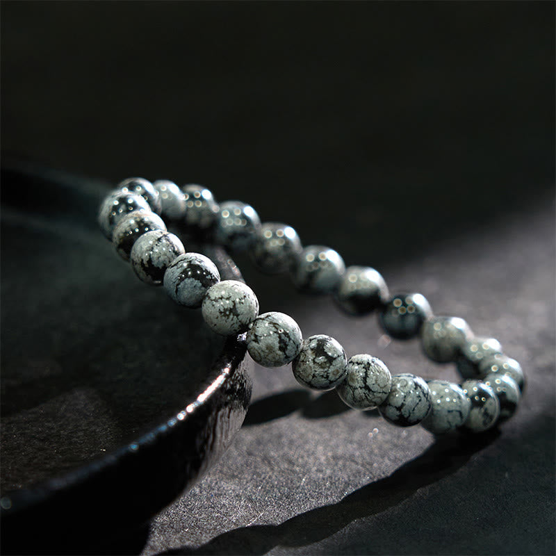 Pulsera de equilibrio de obsidiana y copo de nieve de piedra de Buda