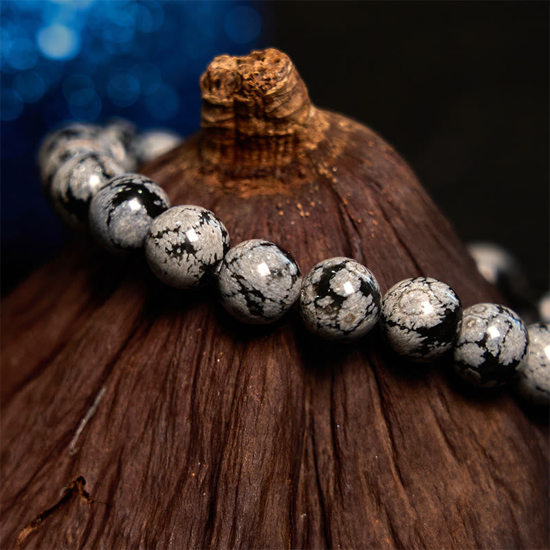 Pulsera de equilibrio de obsidiana y copo de nieve de piedra de Buda