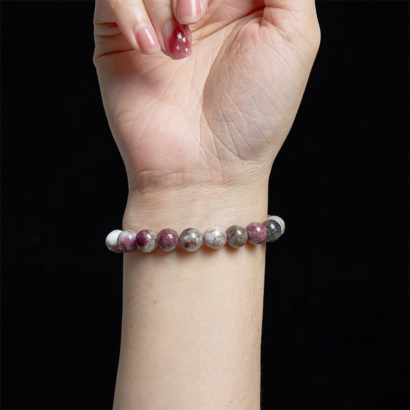 Pulsera de equilibrio de turmalina y flor de ciruelo con piedra de Buda