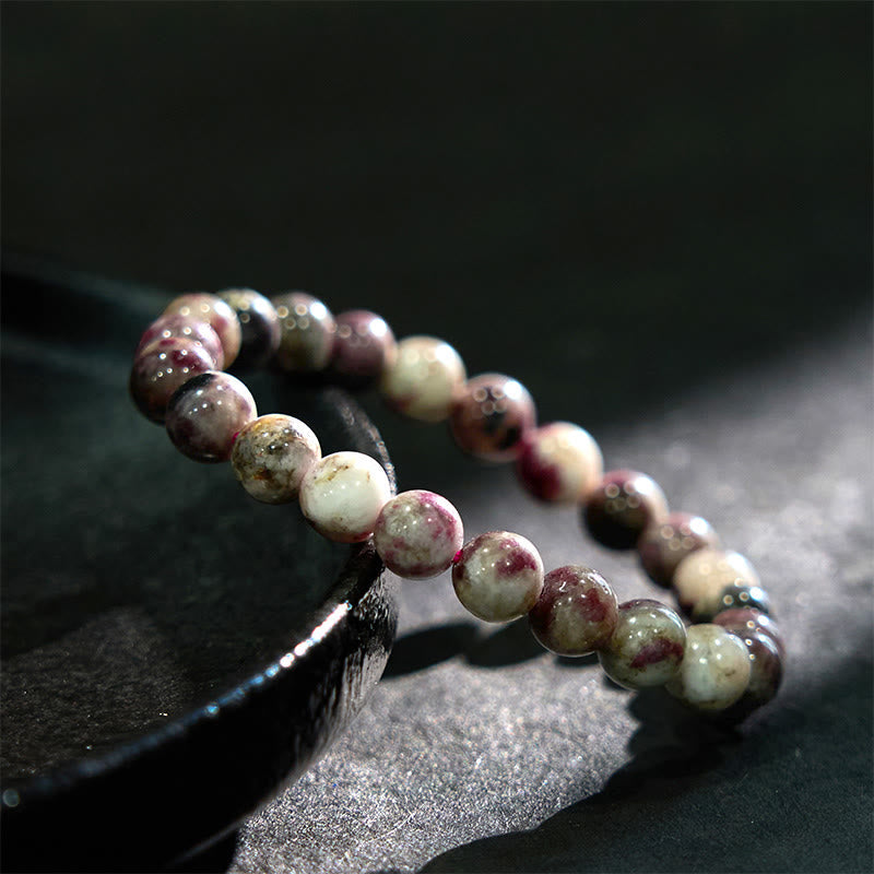 Pulsera de equilibrio de turmalina y flor de ciruelo con piedra de Buda