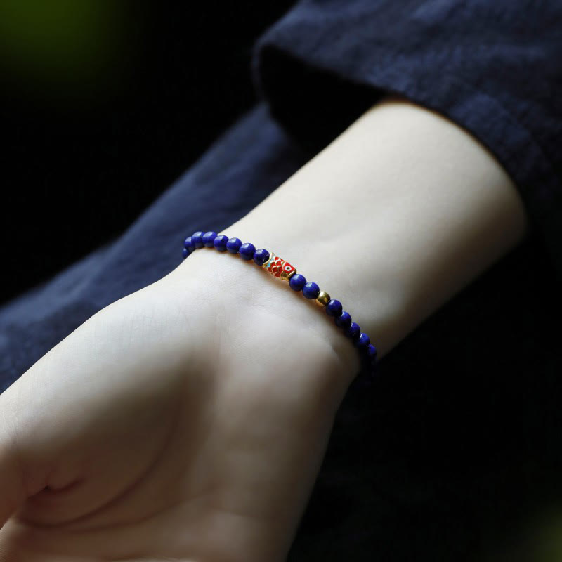 Pulsera positiva de pez koi con lazurita y piedras de Buda