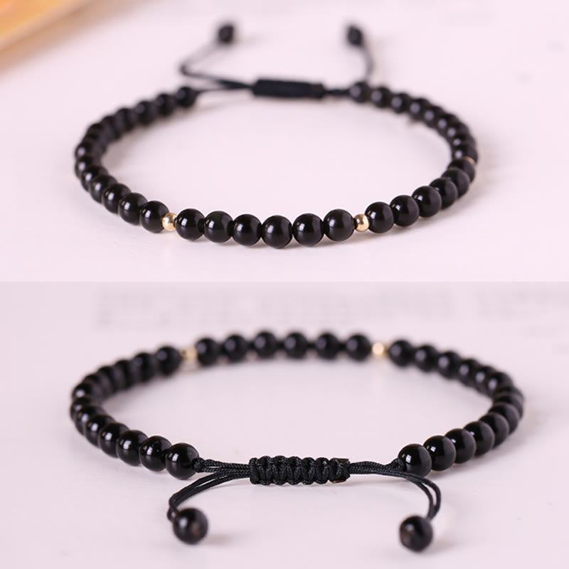 Pulsera de cuerda con pequeñas cuentas de obsidiana negra y piedras de Buda